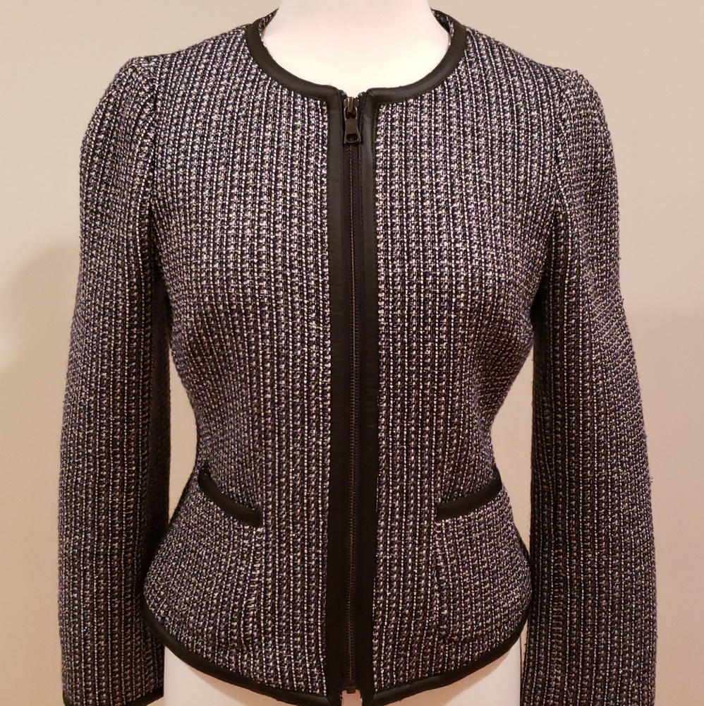 Worn once.Tweed jacket with black leather trimming
